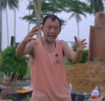 Alvin explaining an idea with both hands raised